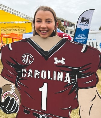 Girl in a football standee