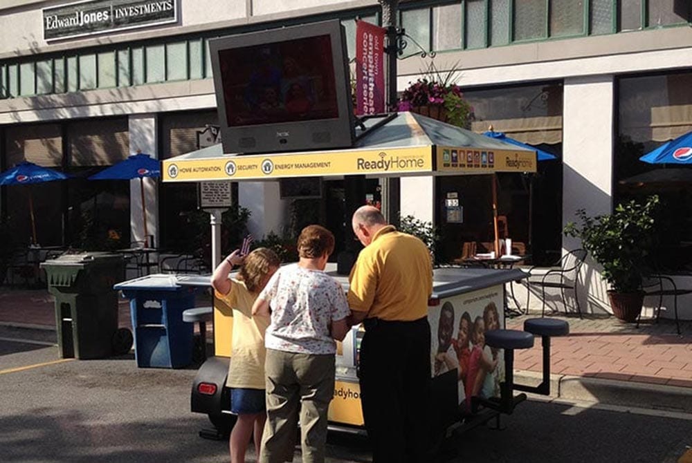 People in front of brandstand